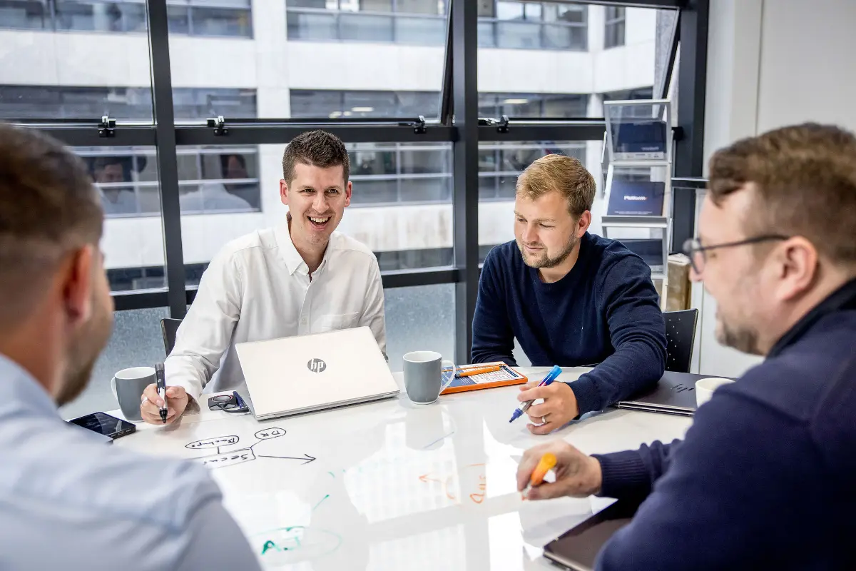 Platform365 team in a meeting discussing IT limitations